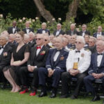 Young Lady is Sitting with Big Senior Group
