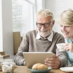 Senior Couple Looking at Tablet