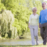 Senior Couple Walking in Garden