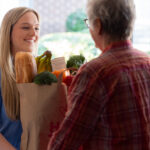 Caregiver Bringing Vegetable for Patient